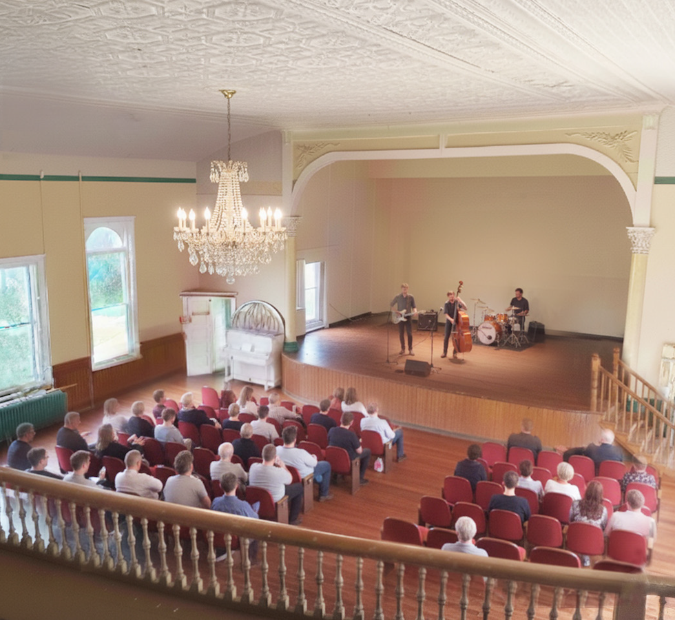 Artist's rendition of what the area could look like with work. A lovely, bright, entertainment area.
