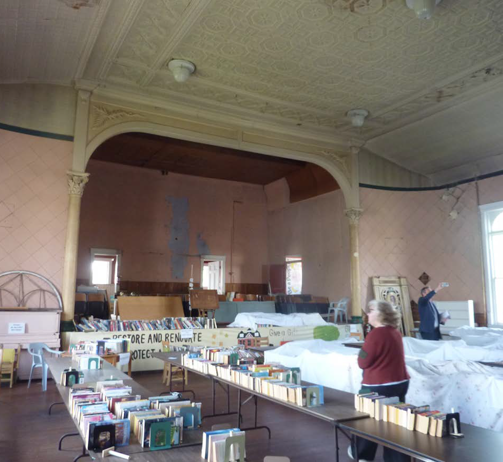 Before image, showing the upstairs looking as it exists today -- dingy, peeling and in need of love.